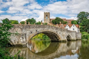 View of Aylesford village with medieval bridge and church in Kent