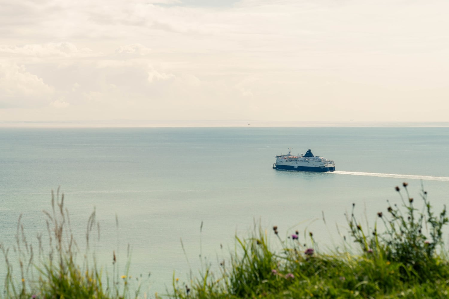 A ferry leaving the coast of Dover in Kent.