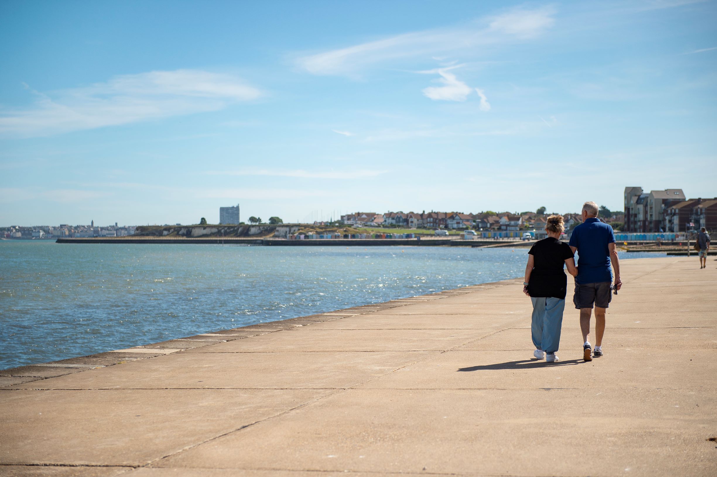 a couple walking on a beach