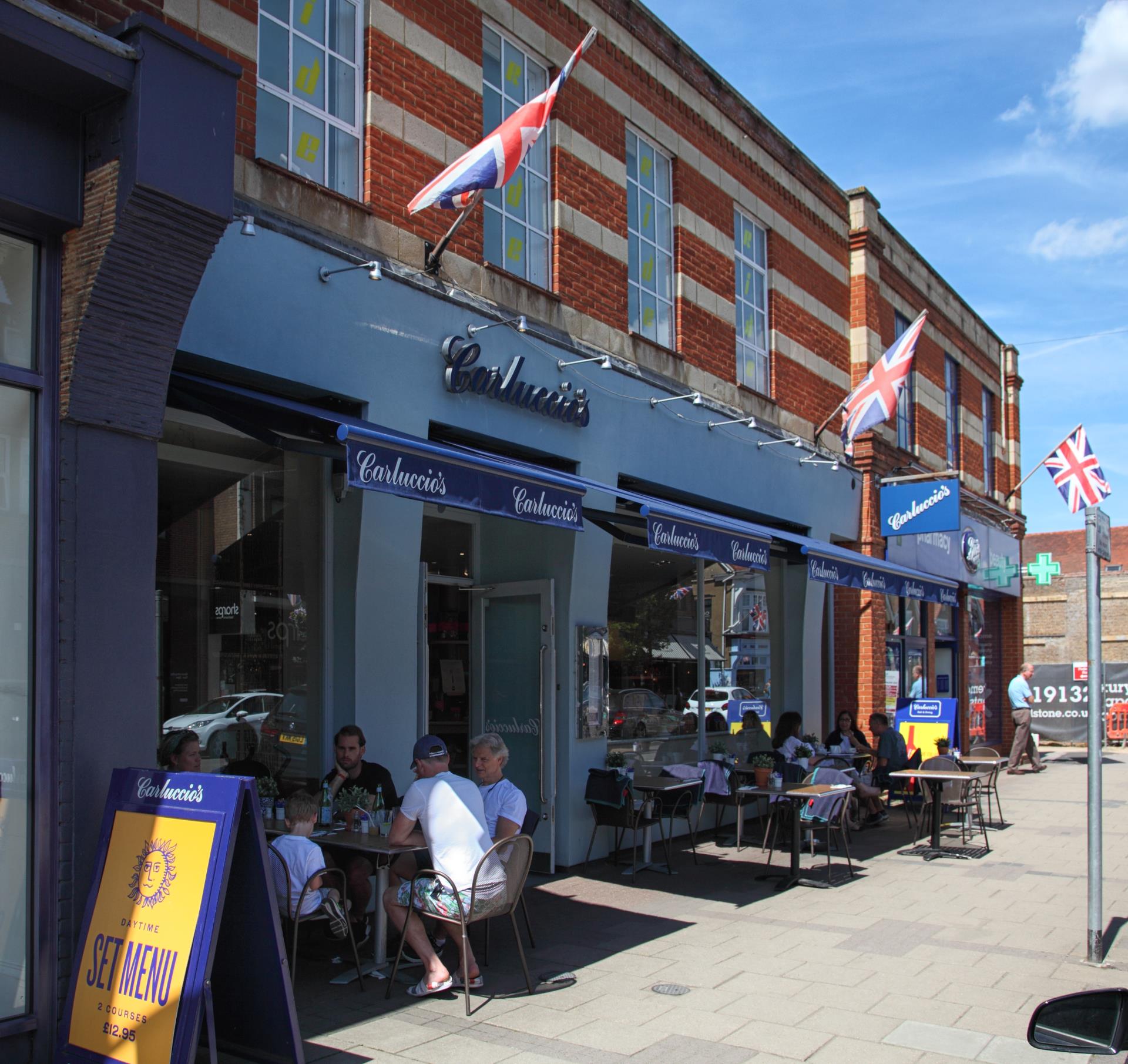people sitting outside a restaurant