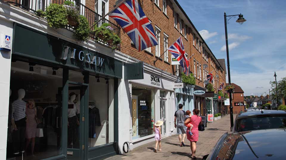 people walking on a sidewalk