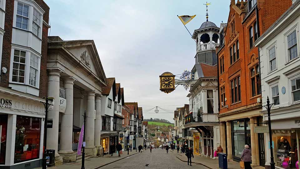 a street with buildings and a clock tower