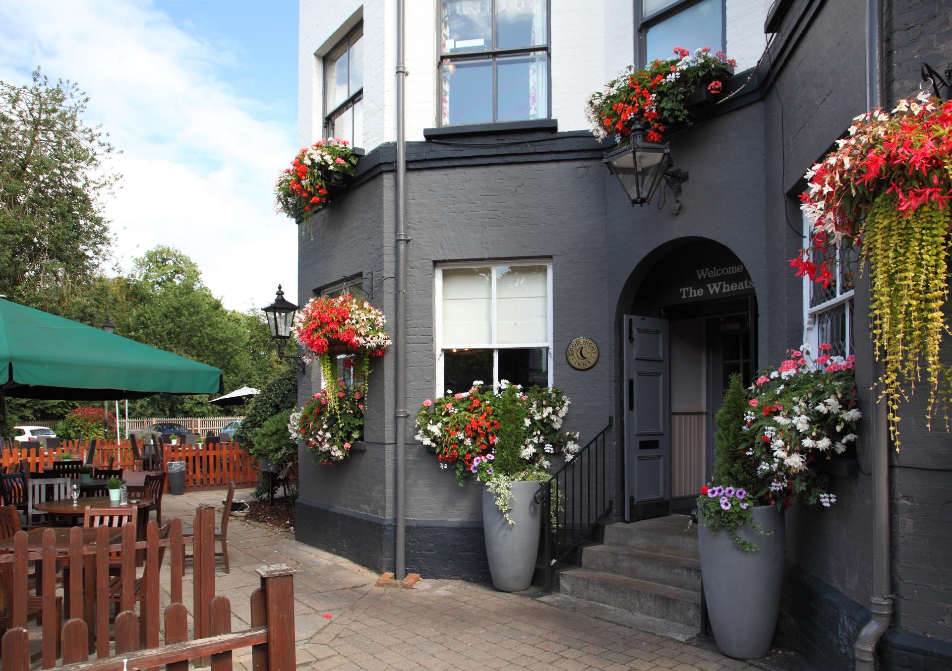 a building with flowers on the windows