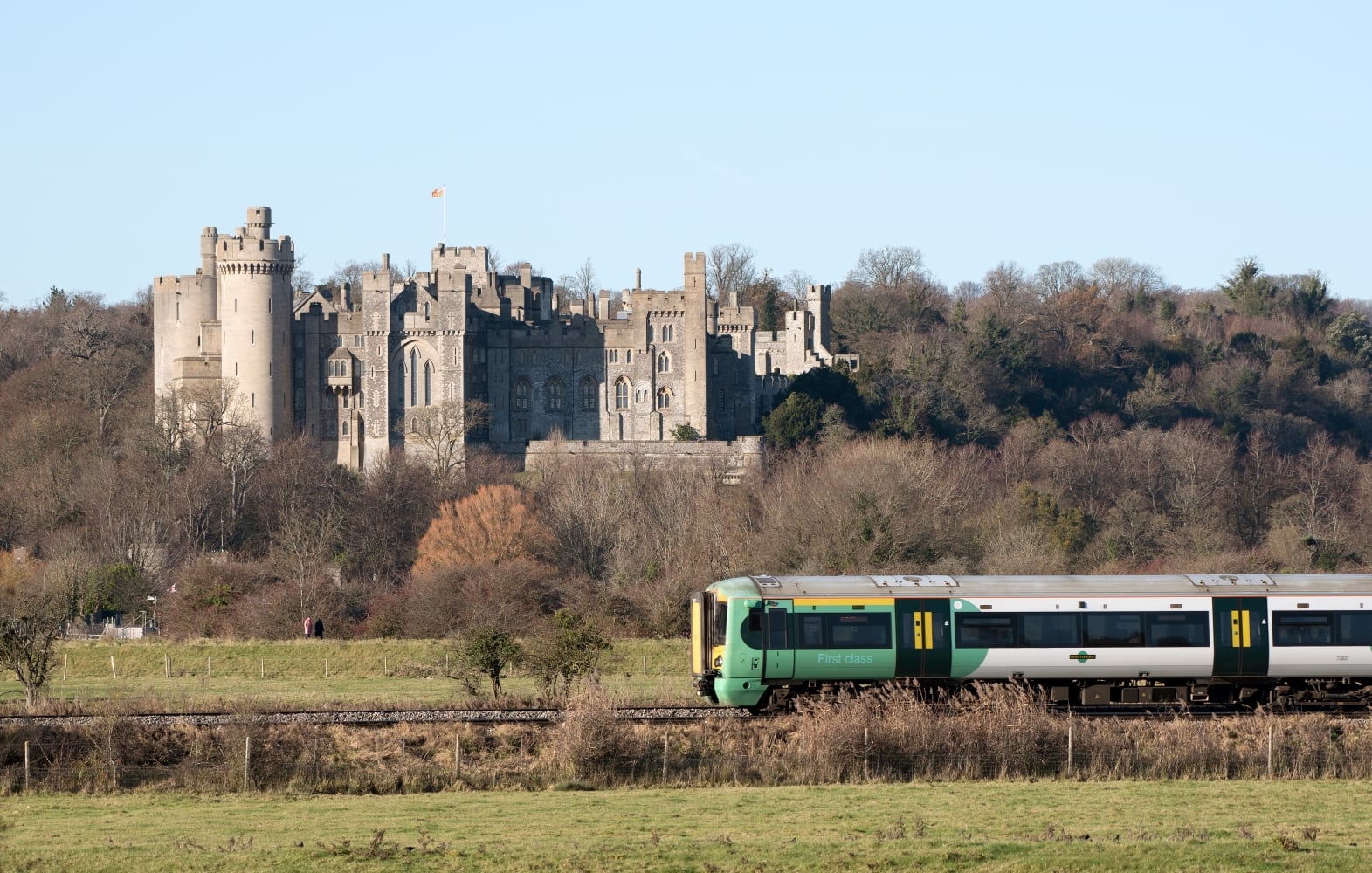 A southern railway passenger train passing Arundel Castle in West Sussex.