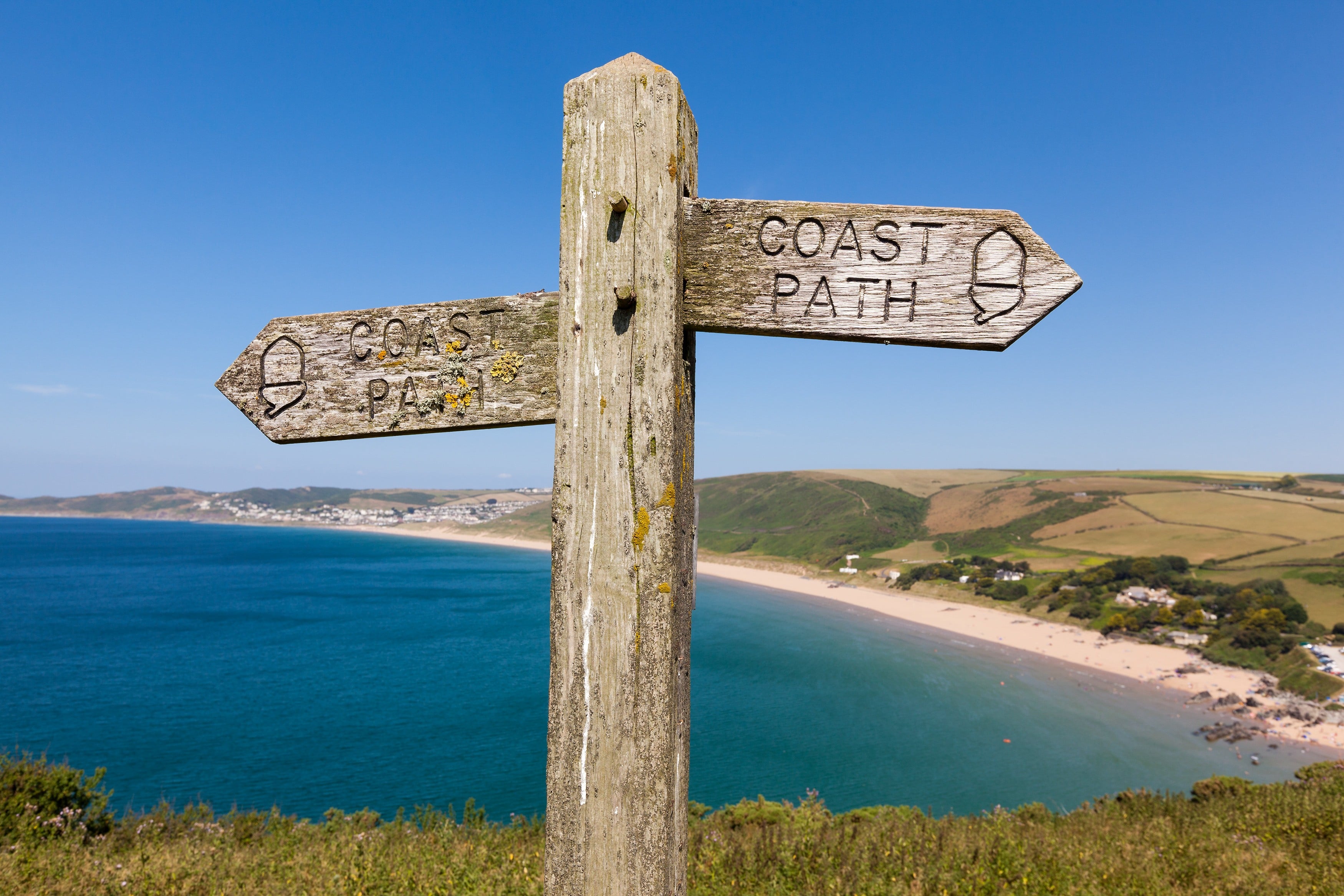 Footpath Sign overlooking Woolacombe Beach in North Devon.