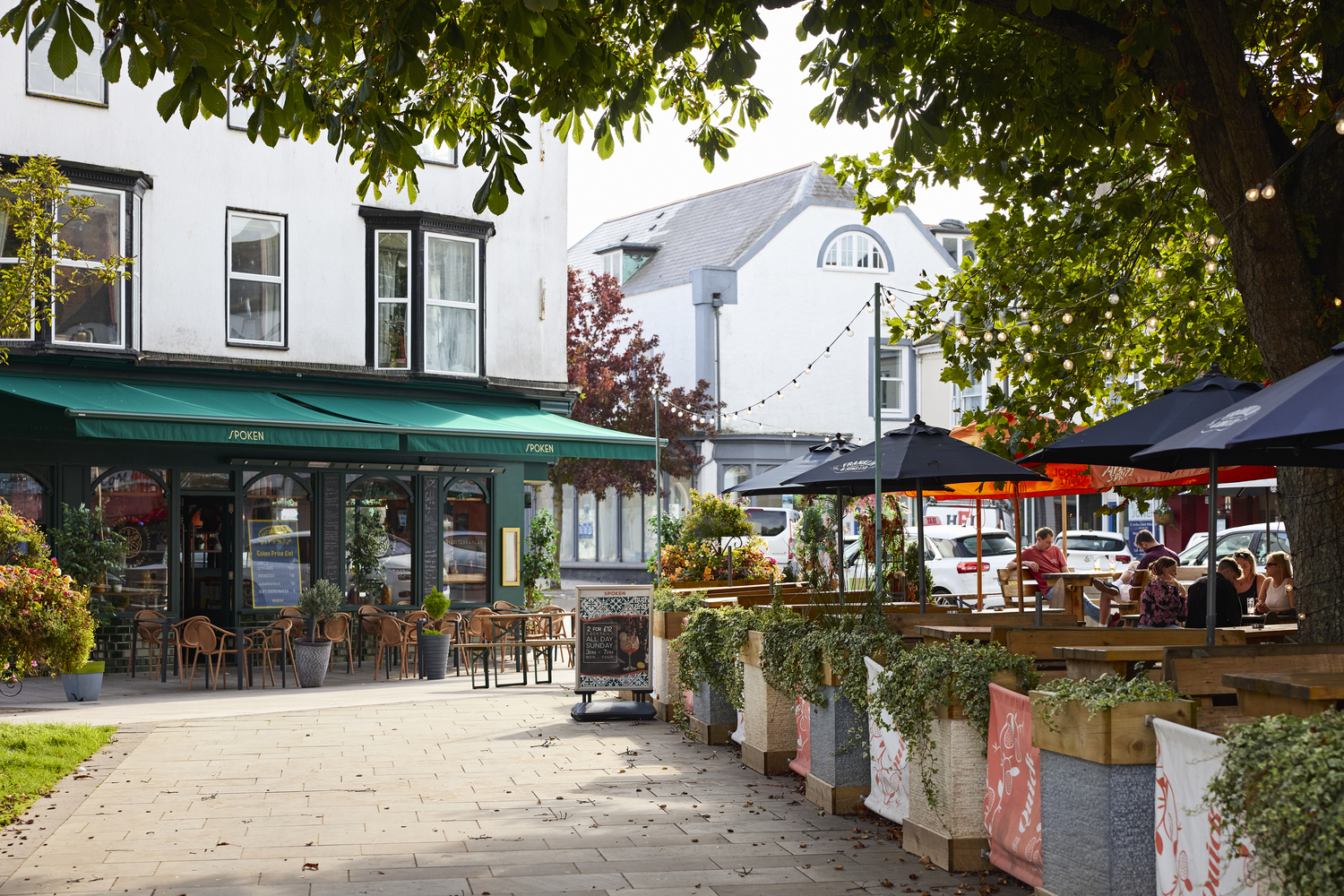 Outdoor dining areas for several restaurants in Exmouth town centre.