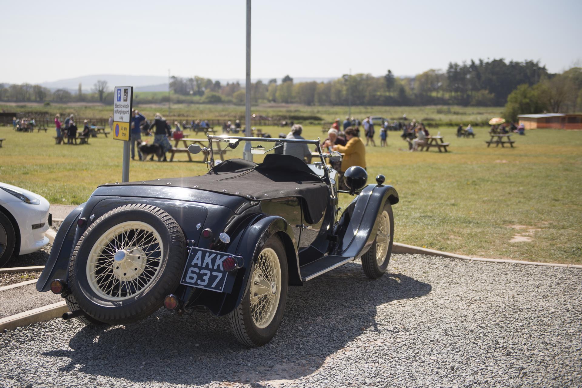 a black car with a large wheel
