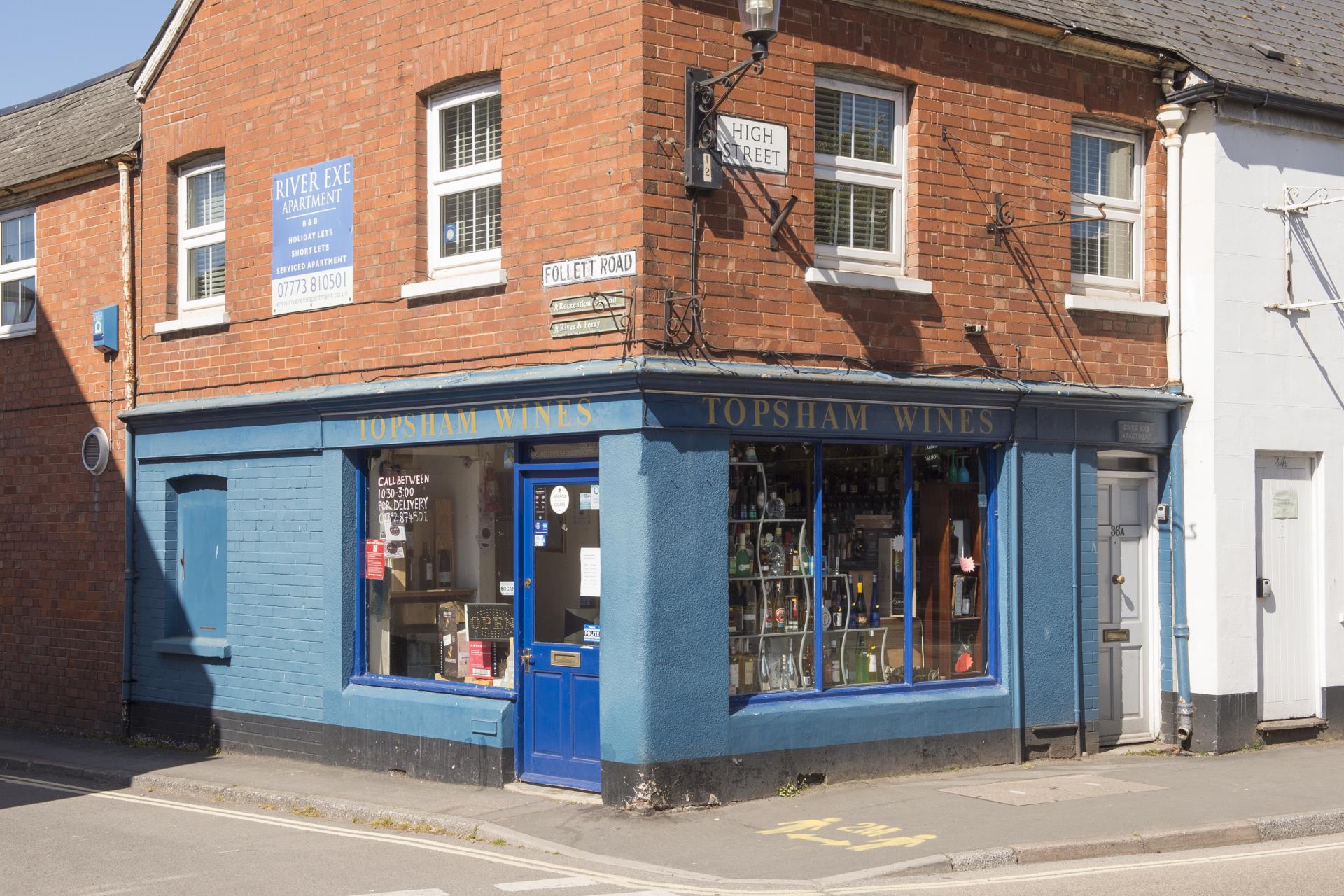a blue building with a blue door with D. H. Lawrence Birthplace Museum in the background