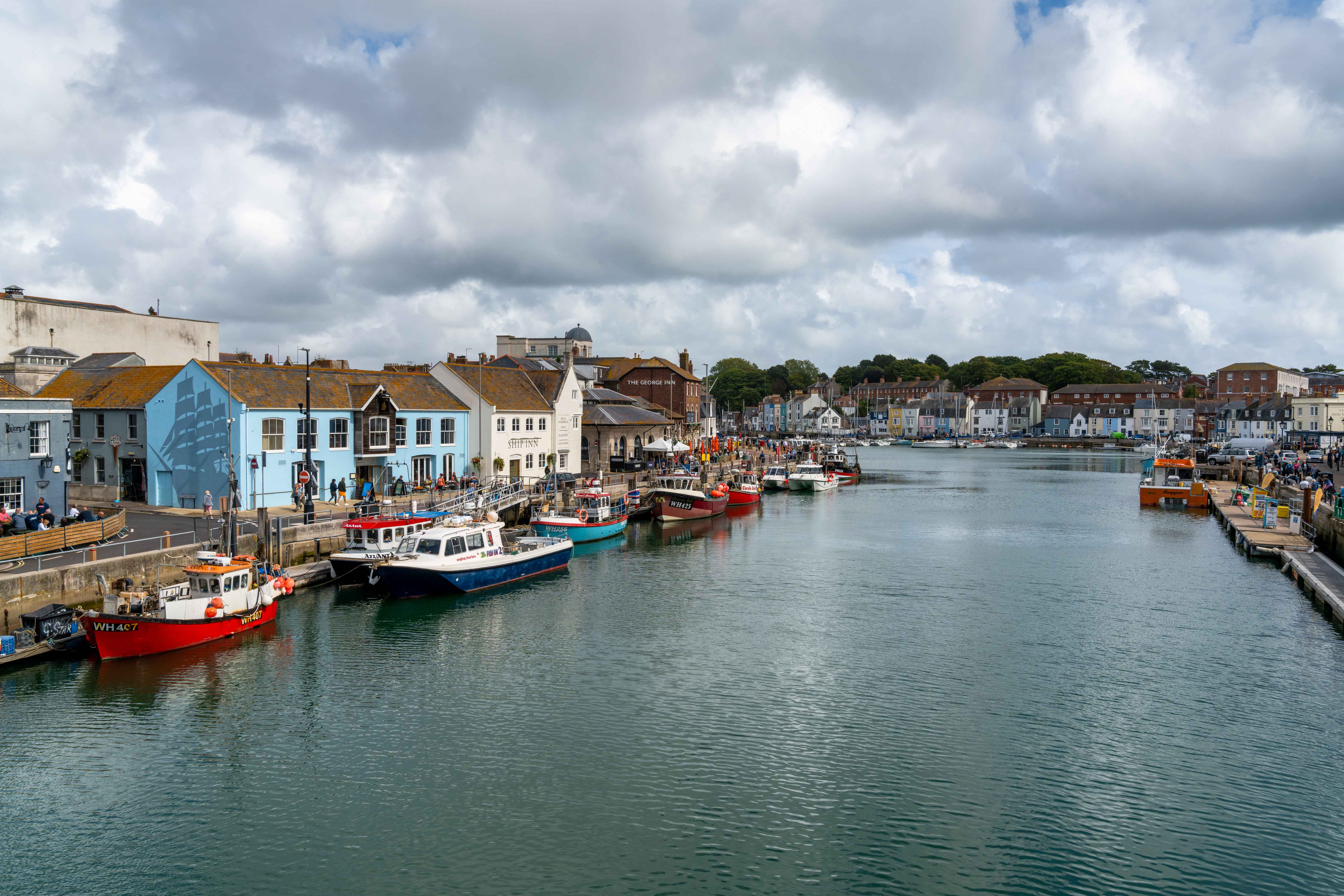 Downtown Weymouth and fishing boats on the River Wey in Dorchester