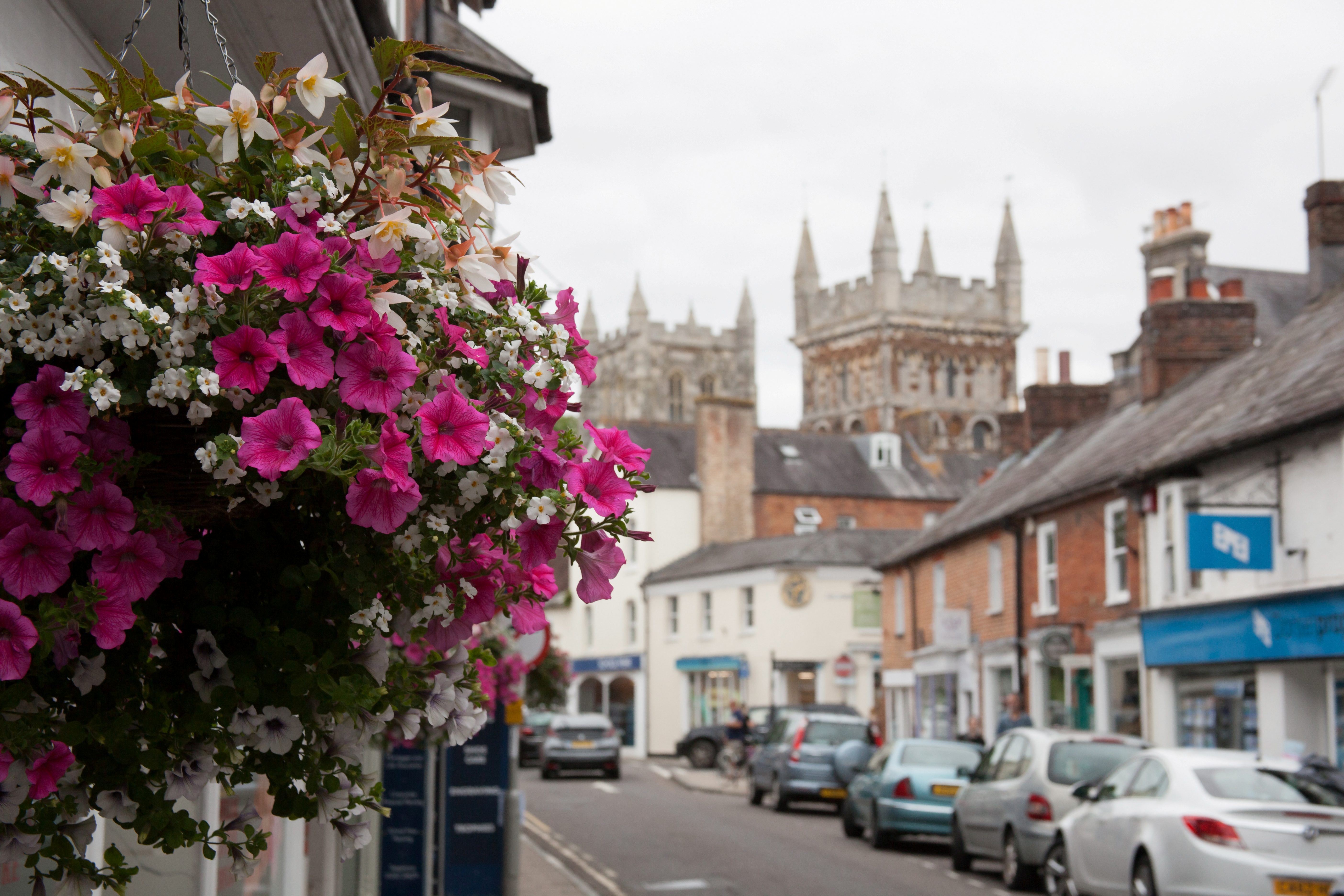 Views of East Street and the Minster Church of St Cuthburga in Wimborne, Dorset in the UK