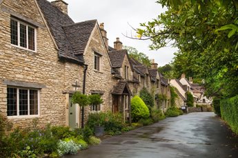 A road with houses in Castle Combe a unique old English village