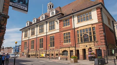 a building with a street sign