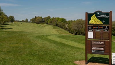 a sign on a golf course