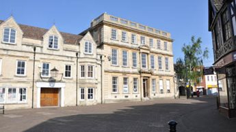 a large building with a tree in front of it