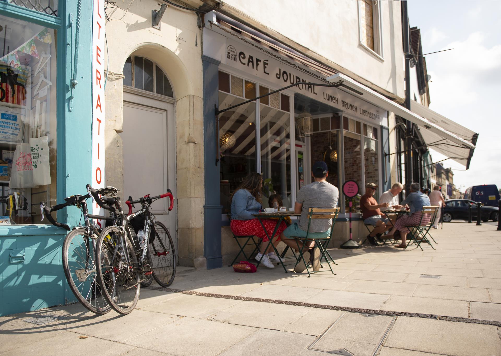 people sitting outside a cafe