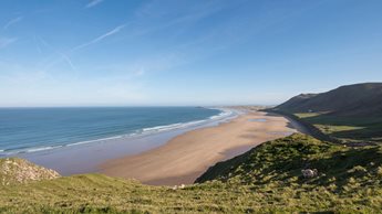 a beach with a body of water