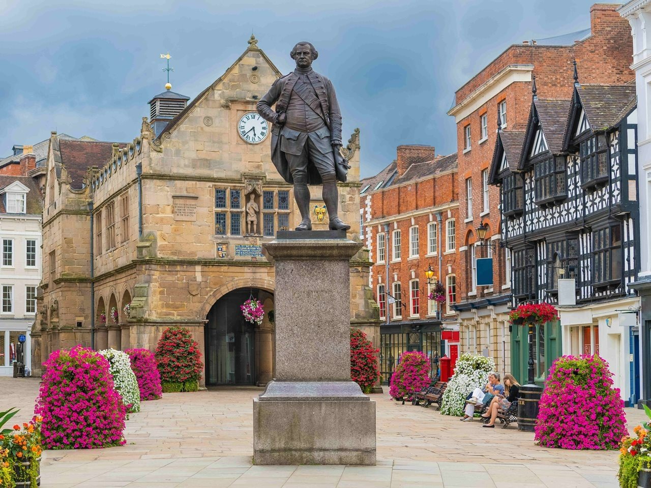 a statue of a person in front of a building