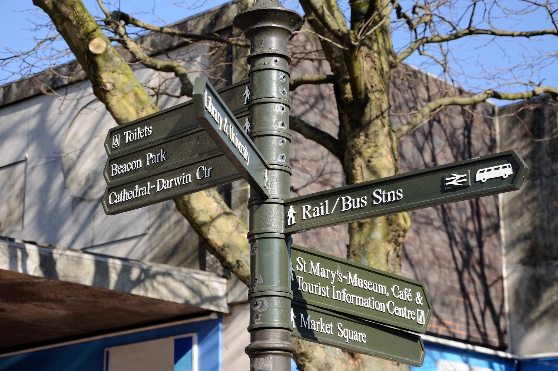 A signpost in Lichfield directing to several attractions and amenities.