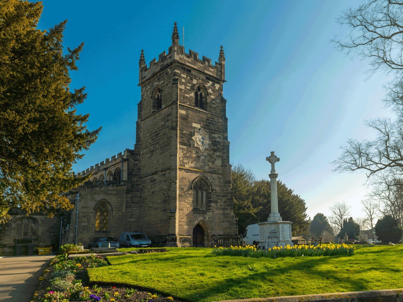 a stone church with a cross on top