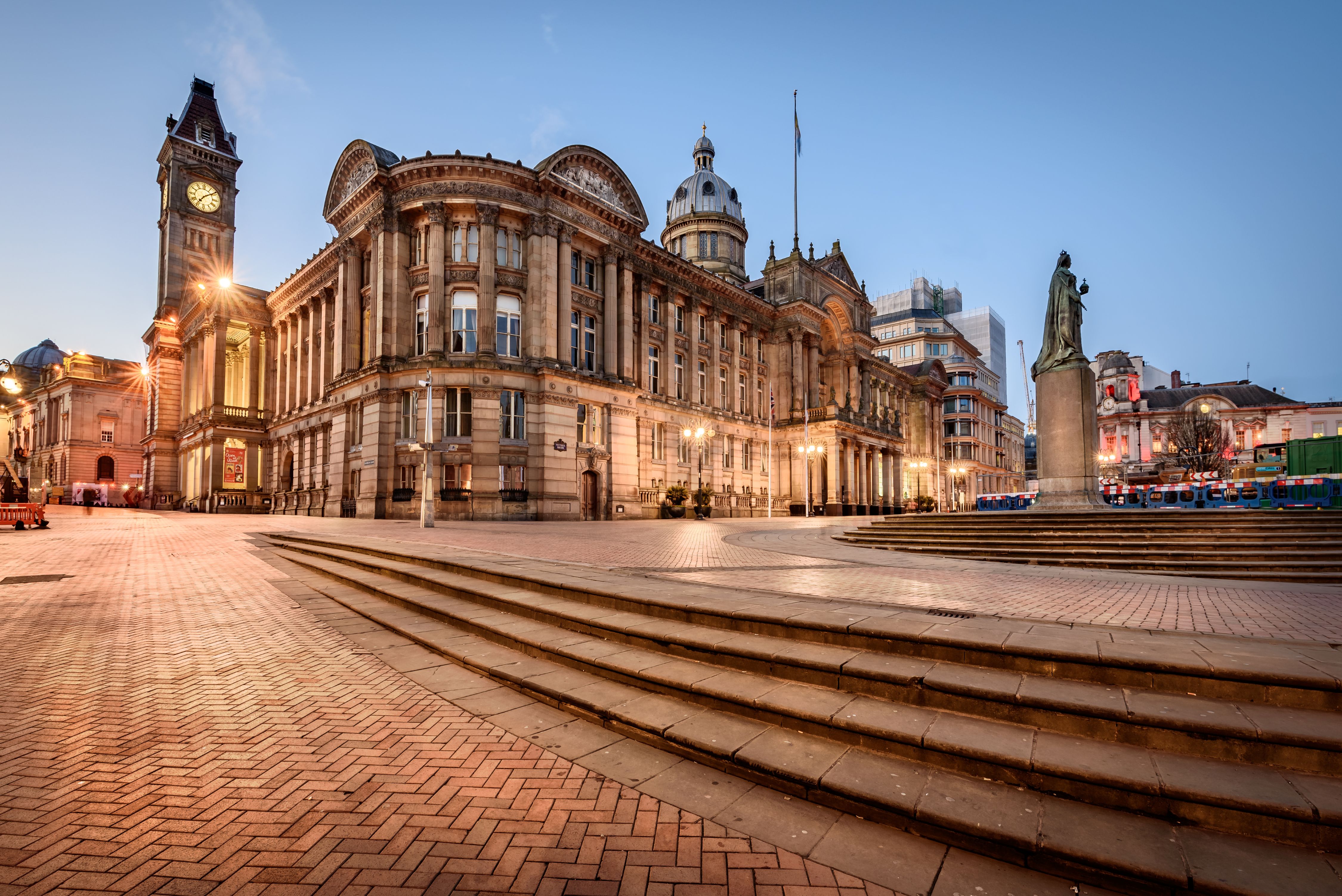An exterior view of Birmingham Council House at dusk.