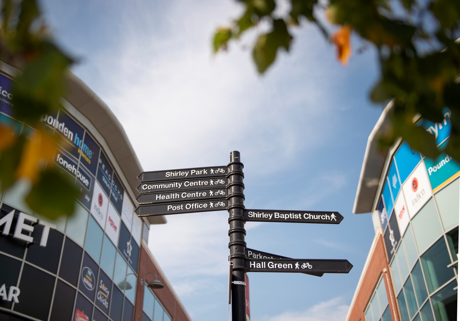 Signpost providing directions to various amenities in Shirley.