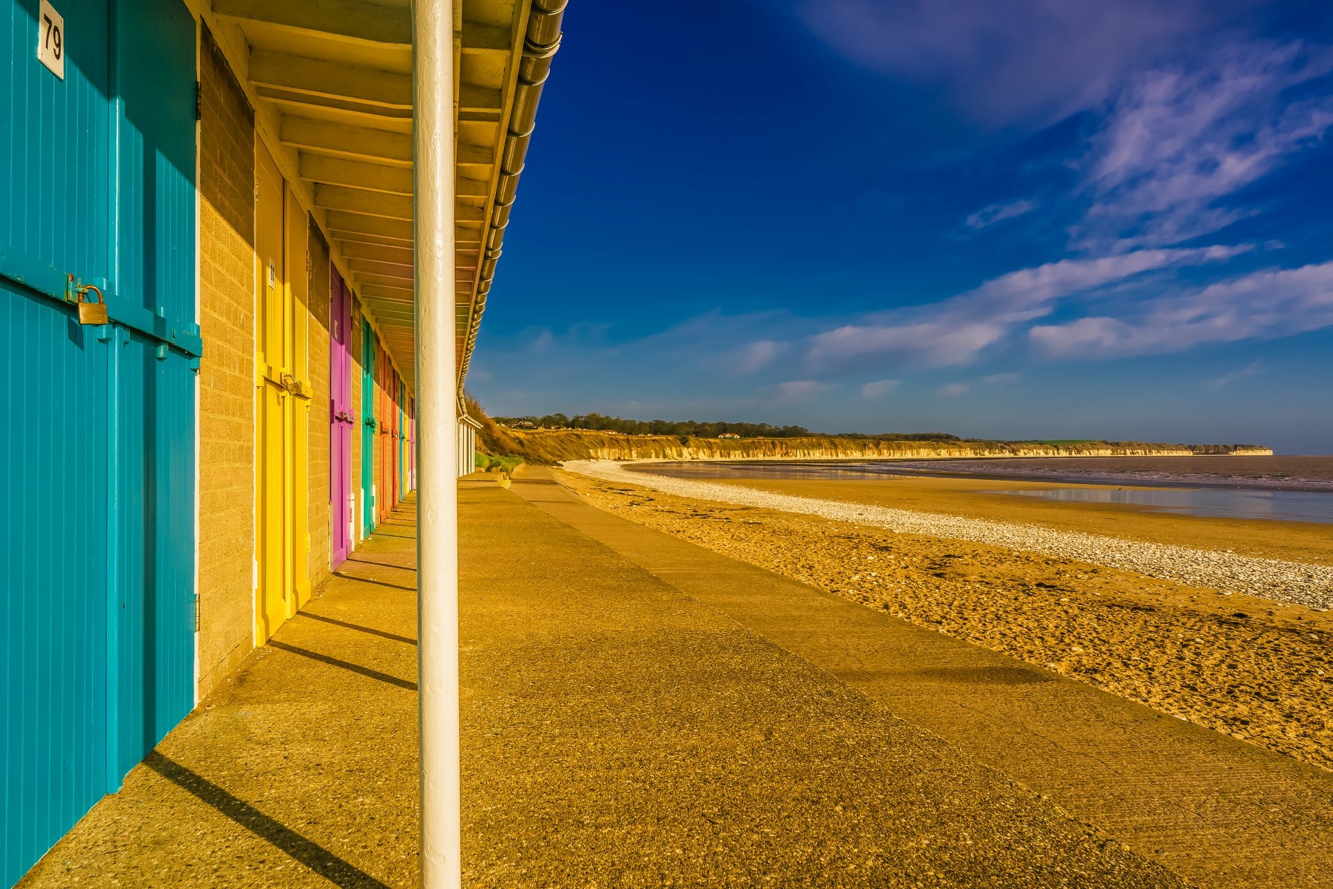 A row of colourful beach huts along North Beach, Bridlington.