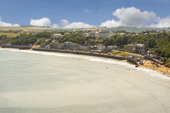 An aerial view of Filey town and beach on a sunny day.