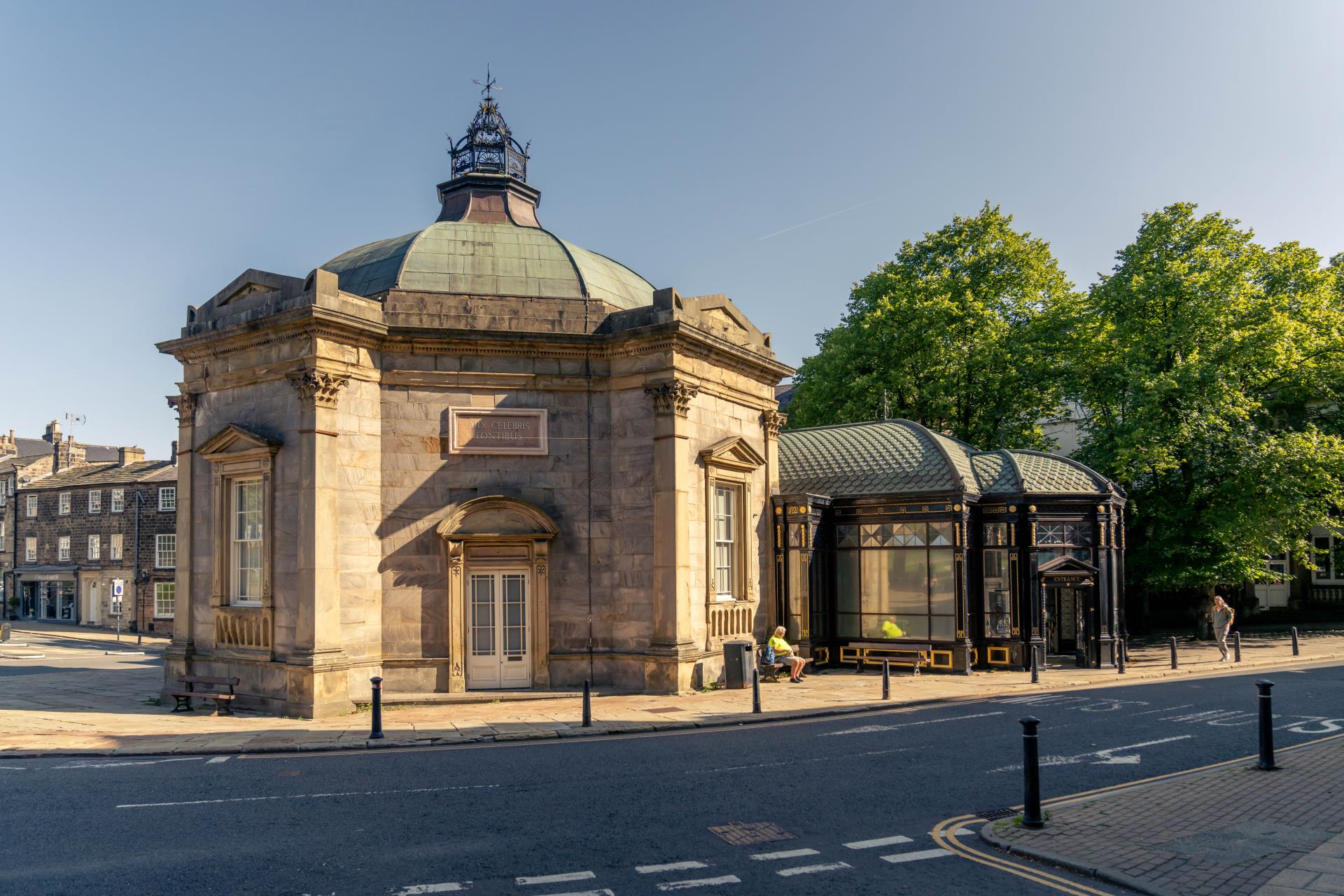 a large building with a dome roof with Royal Pump Room, Harrogate in the background