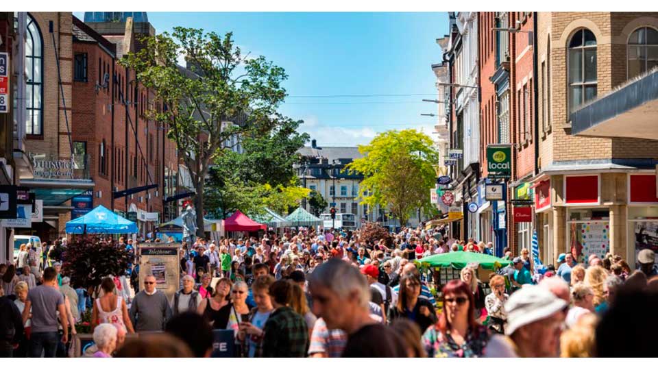 a crowd of people in a street