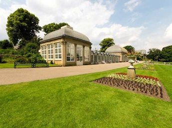 a building with a large lawn