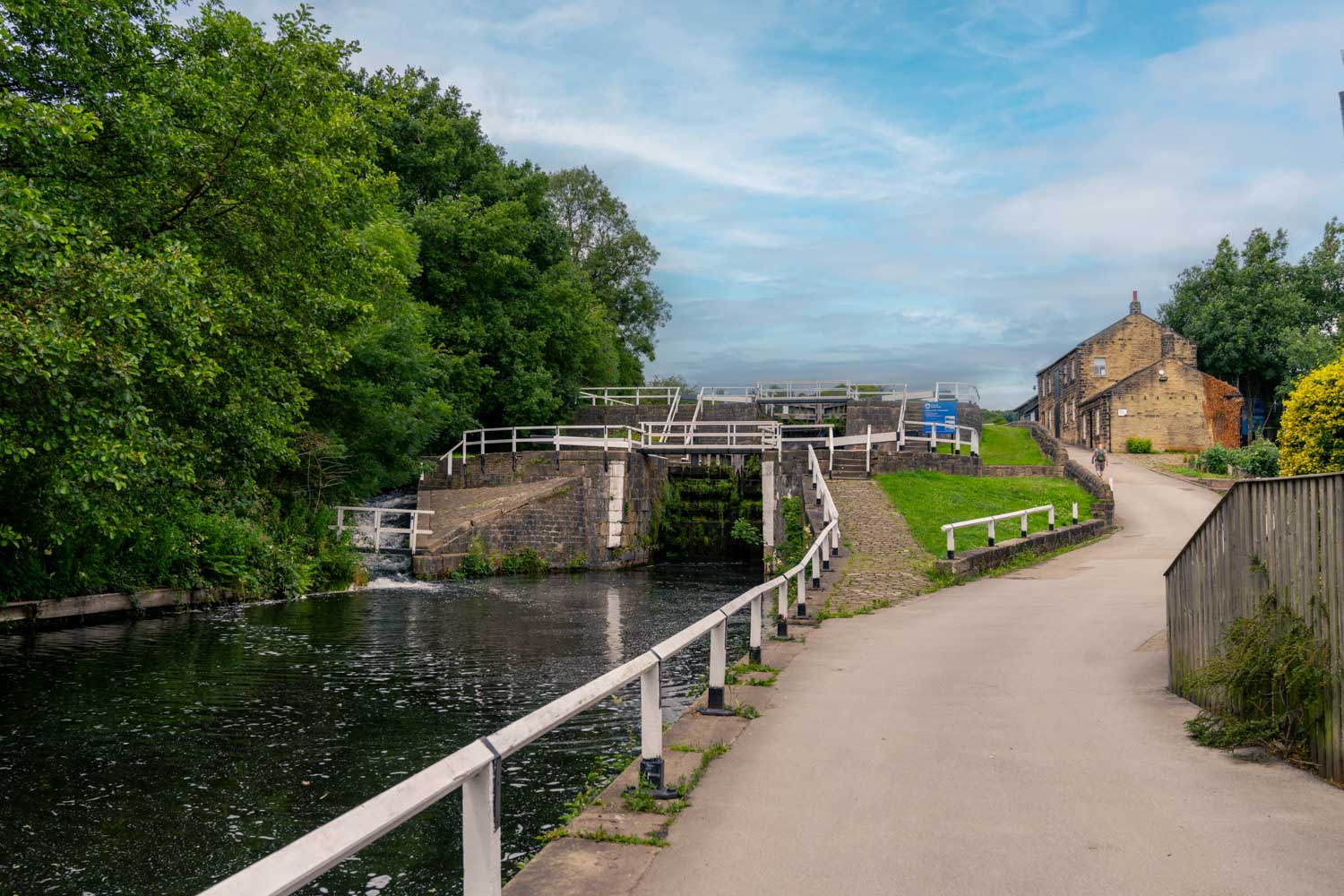 a canal with buildings and trees