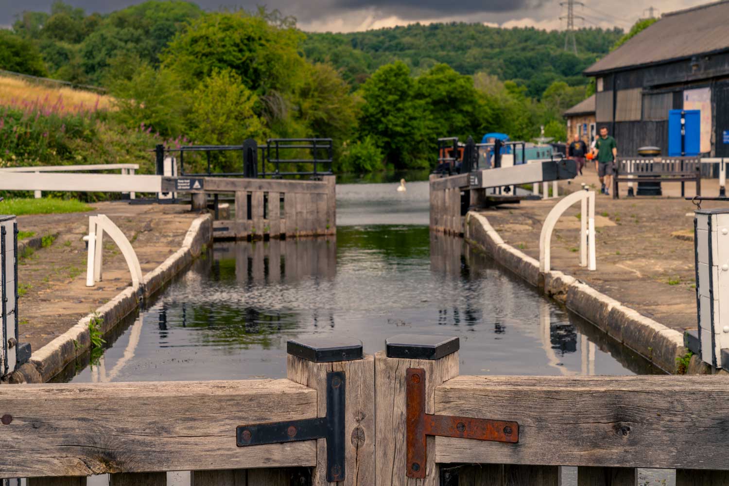 a body of water with a dock and a boat on it