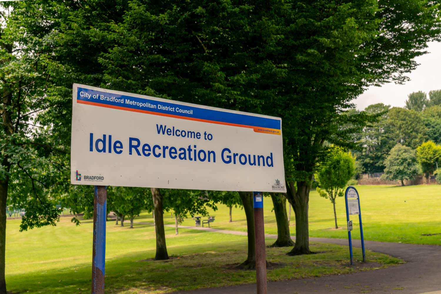 a sign in a park