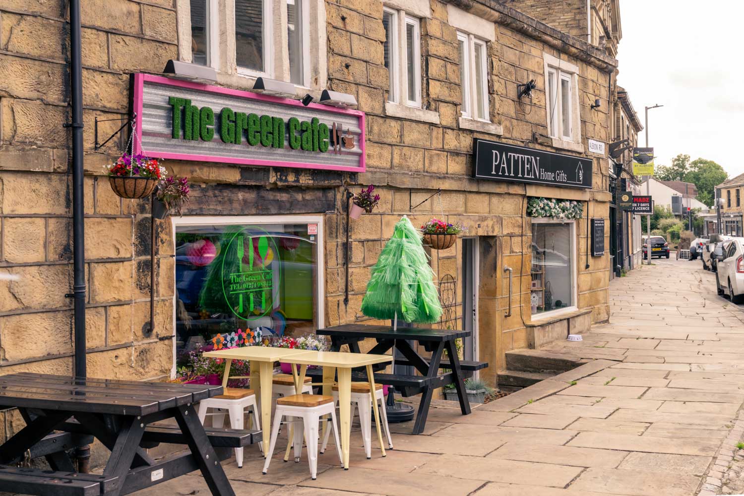a restaurant with tables and chairs outside