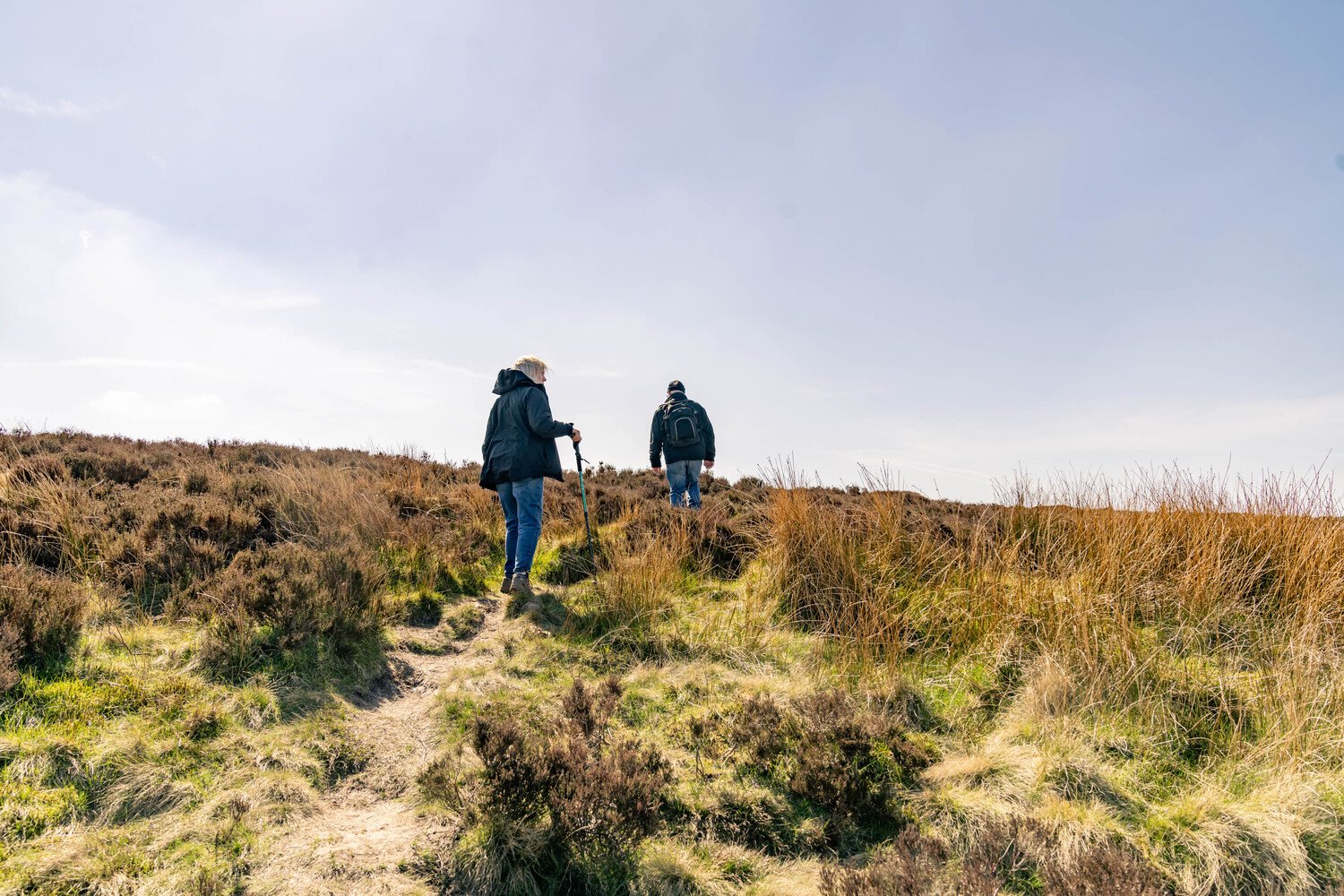 Two retirees hiking over the Yorkshire Moors in Burley in Wharfedale