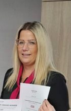 a person holding a piece of paper