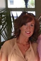 a woman with a large smile