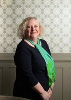 a person with a green scarf