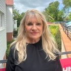 a woman smiling for the camera