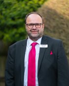 a man wearing a suit and tie