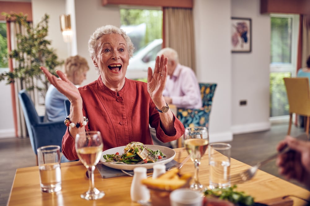 A retired lady enjoying a meal at a McCarthy Stone bistro