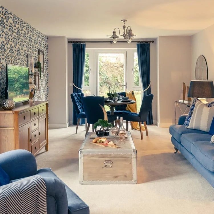 a living room with blue couches