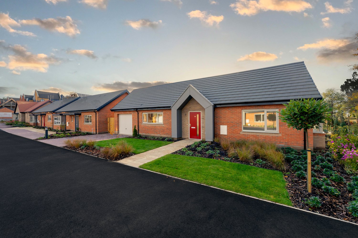 A McCarthy Stone retirement bungalow featuring a driveway and front garden.