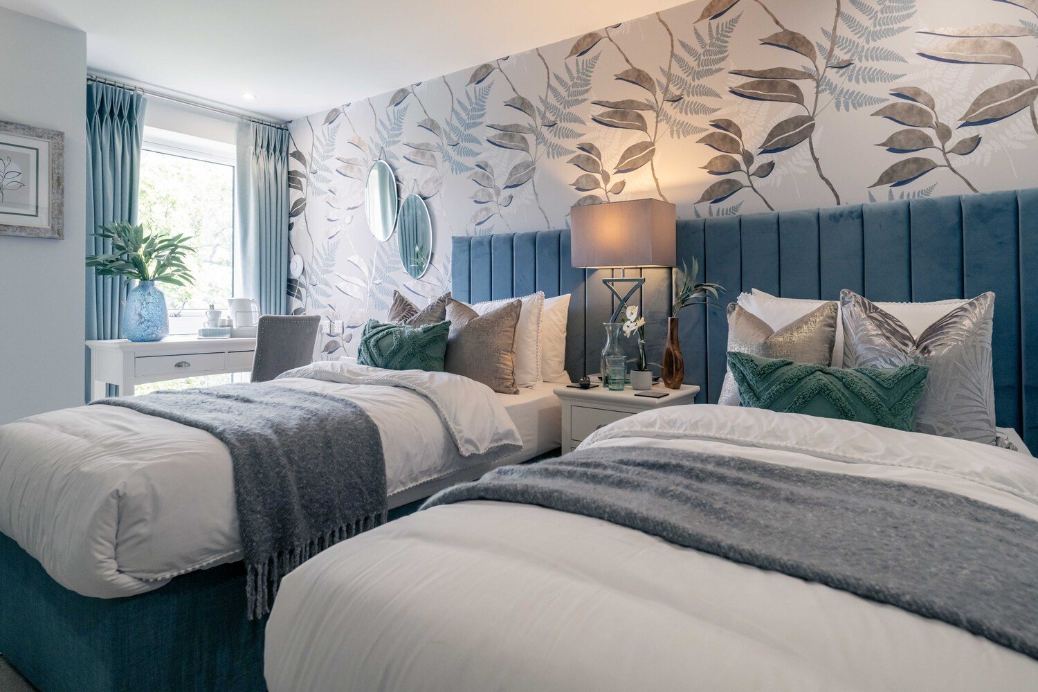 A twin bed hotel-style guest suite at a McCarthy Stone retirement development.