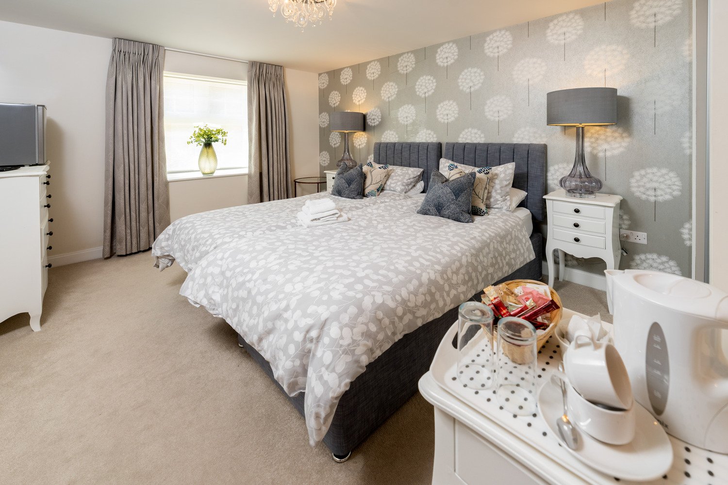 A twin bed hotel-style guest suite at a McCarthy Stone retirement development.