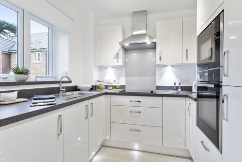 a kitchen with white cabinets
