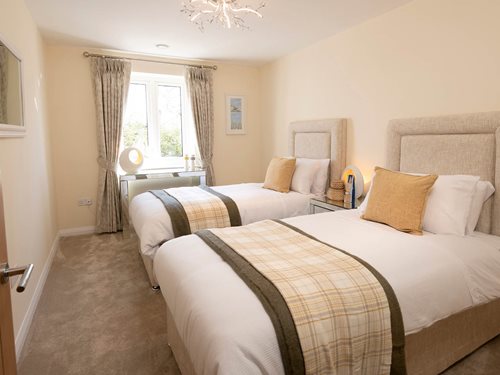 a couple of beds in a hotel room