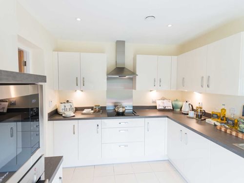 a kitchen with white cabinets