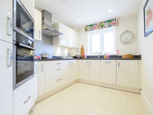 a kitchen with white cabinets