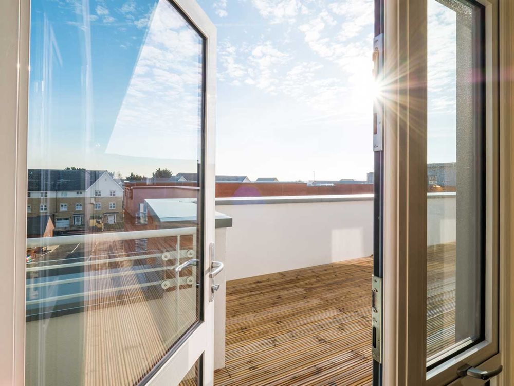 a room with a view of a city and a large window